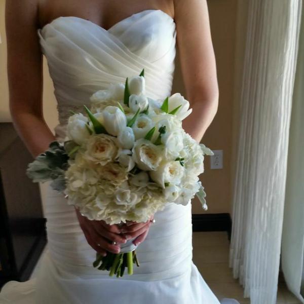 White hydrangeas, garden roses, ranunculus and white tulips